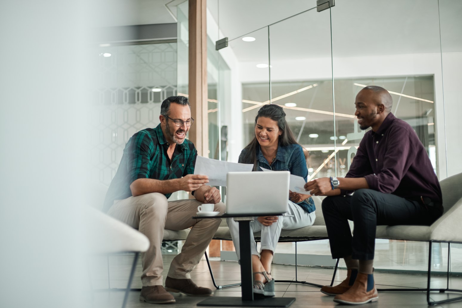 Casual meeting of smiling diverse business team