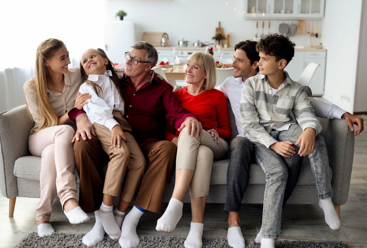 Multigenerational family relaxing on a couch